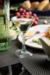 Martini glass with a bottle. Snacks for vermouth. Snacks for Martini.