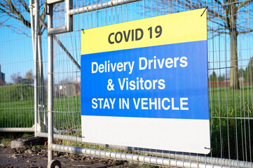 Construction building site Covid-19 health and safety sign for delivery driver