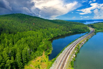 railway runs along lake shore, forest, nature, bird's eye view