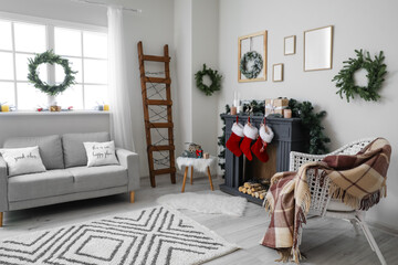 Decorated fireplace in interior of room on Christmas eve