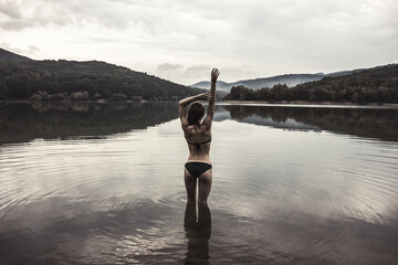 Fototapeta na wymiar Swimming in the lake. Departure for nature. Young girls