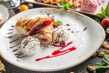 Espresso and homemade ice cream in the restaurant: strawberry, vanilla, citrus. Delicious and fresh dessert.