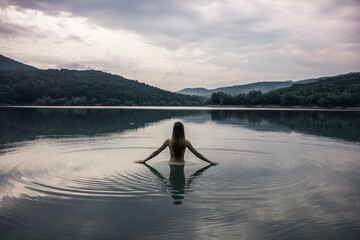 Swimming in the lake. Departure for nature. Young girls