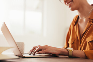 Woman working on laptop at home