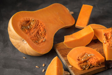 Selective focus shot of Butternut squash sliced on a cutting board