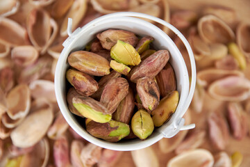 handful of whole and peeled pistachios