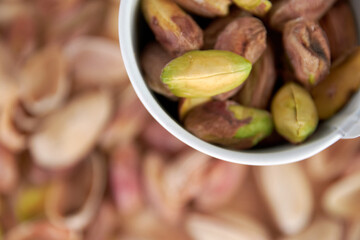 handful of whole and peeled pistachios