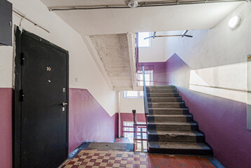 Russia, Moscow- April 17, 2020: interior public place, house entrance. doors, walls, staircase corridors, stairs, steps