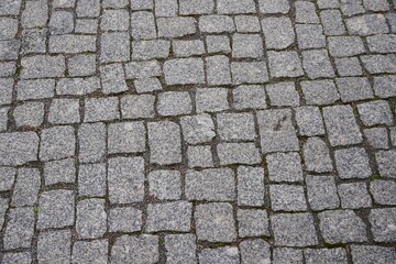 Old gray pavement in historical city centre