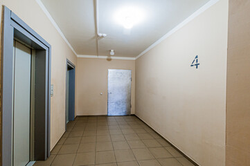 Russia, Moscow- April 17, 2020: interior public place, house entrance. doors, walls, staircase corridors