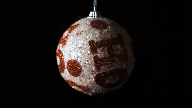 Christmas tree decorations on a black background. Festive Christmas balls on a dark, isolated. New Year tree and holiday concept.