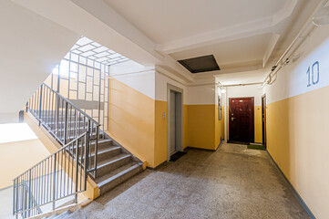 Russia, Moscow- April 17, 2020: interior public place, house entrance. doors, walls, staircase corridors, stairs, steps