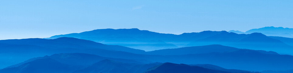 horizontal banner. hilly landscape in shades of blue