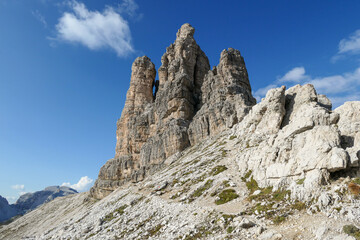 A panoramic view on Toblinger Knoten and surrounding mountains in Italian Dolomites. Difficult ad dangerous climbing route. Stony valley below. Few narrow pathways on the side. Freedom and serenity