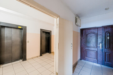 Russia, Moscow- April 17, 2020: interior public place, house entrance. doors, walls, staircase corridors