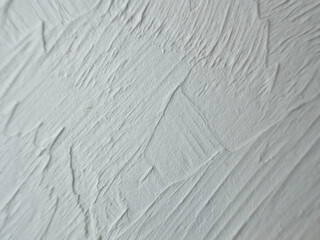 Grungy white background of stone or concrete wall. Old wrinkled texture.