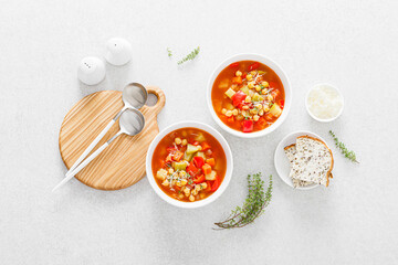 Tuscan tomato chickpea soup with various vegetables, thyme and parmesan cheese, top view