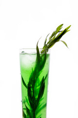 a refreshing cocktail with leaves of tarragon and ice