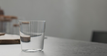 empty thin glass on kitchen countertop