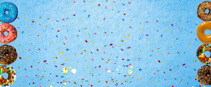 colorful donut with sprinkle on blue background. Background image with copy space