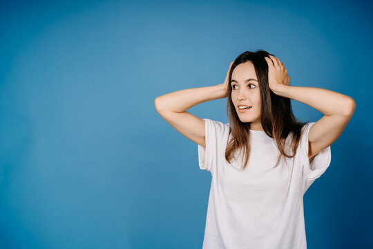 Amased girl isolated on blue background