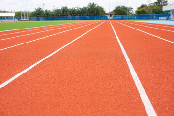 Red treadmill for running have white line soft background