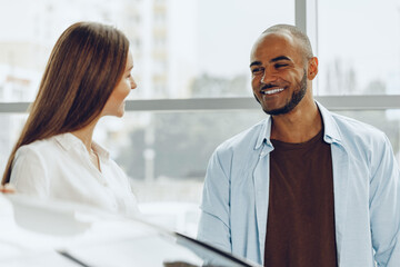 Fototapeta premium Man and woman having a talk in office