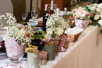 Room with decorated tables and chairs, wedding ceremony, buffet and dining room in the scenery.