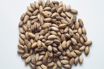 Nuts on an insulated white table. Pistachio. It grows in Turkey. It is a special product. ( Antep fıstıgı)