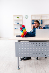 Young male businessman working in the office