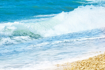 Obraz premium Sea landscape, wave, white foam. Natural waves and beach