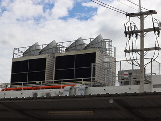 Fototapeta na wymiar The industry cooling tower air conditioner is a water cooling tower air chiller of large industrial 