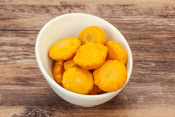 Marinated yellow patisson in the bowl