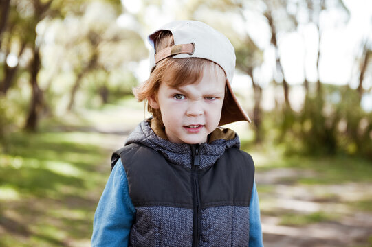 Cute preschooler boy in cap.