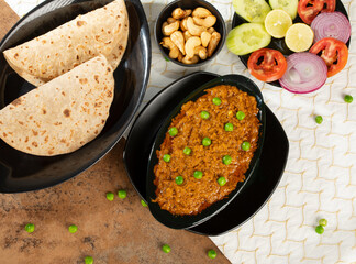 Rajasthani Famous Traditional Cuisine Haldi Sabji or Tukkar Served with Salad 