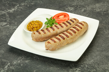 Grilled natural pork sausages with sauce