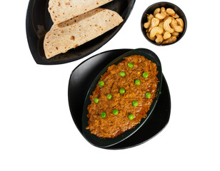 Rajasthani Famous Traditional Cuisine Haldi Sabji or Tukkar Served with Salad on White Background