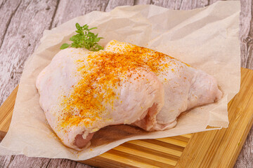 Raw chicken thigh with spices