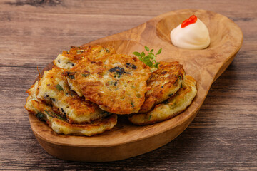 Zucchini pancakes with herbs and spices