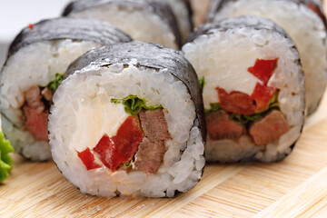 Maki sushi roll served on plate close up