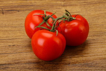 Red bright ripe tomato branch