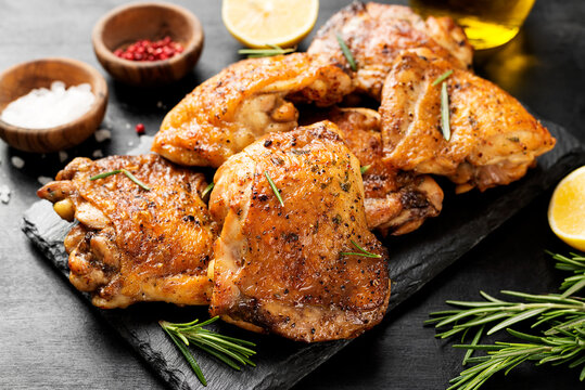 Grilled chicken thighs with spices and lemon.	