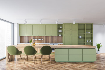 White and green kitchen interior with table