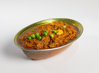 Rajasthani Famous Traditional Cuisine Haldi Sabji or Tukkar Served with Salad on White Background