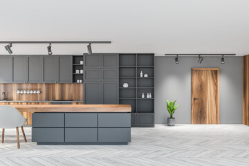 White and gray kitchen interior with table and door