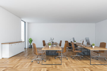 Office consulting room with leather chairs and computers on table, wooden design