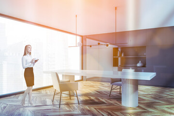 Woman in gray panoramic dining room