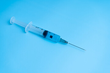 Syringe with coronavirus vaccine and a chip inside the vaccine. Conspiracy theory. Chipping people