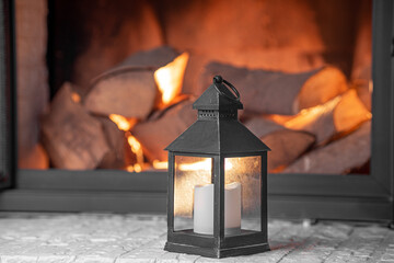 lantern in front of the fireplace