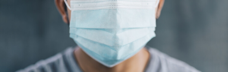 close up of Male wearing medical masks over gray background